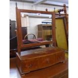An 18 1/2" Victorian mahogany platform dressing table mirror with remains of painted decoration to