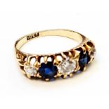 An 18ct. gold ring, set with three diamonds interspersed with two sapphires