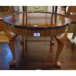 A 24" diameter reproduction quarter veneered flame mahogany pie crust tea table, set on cabriole