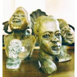 Four African carved stone heads