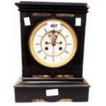 A late Victorian black slate and marble cased mantel clock with visible anchor escapement and French