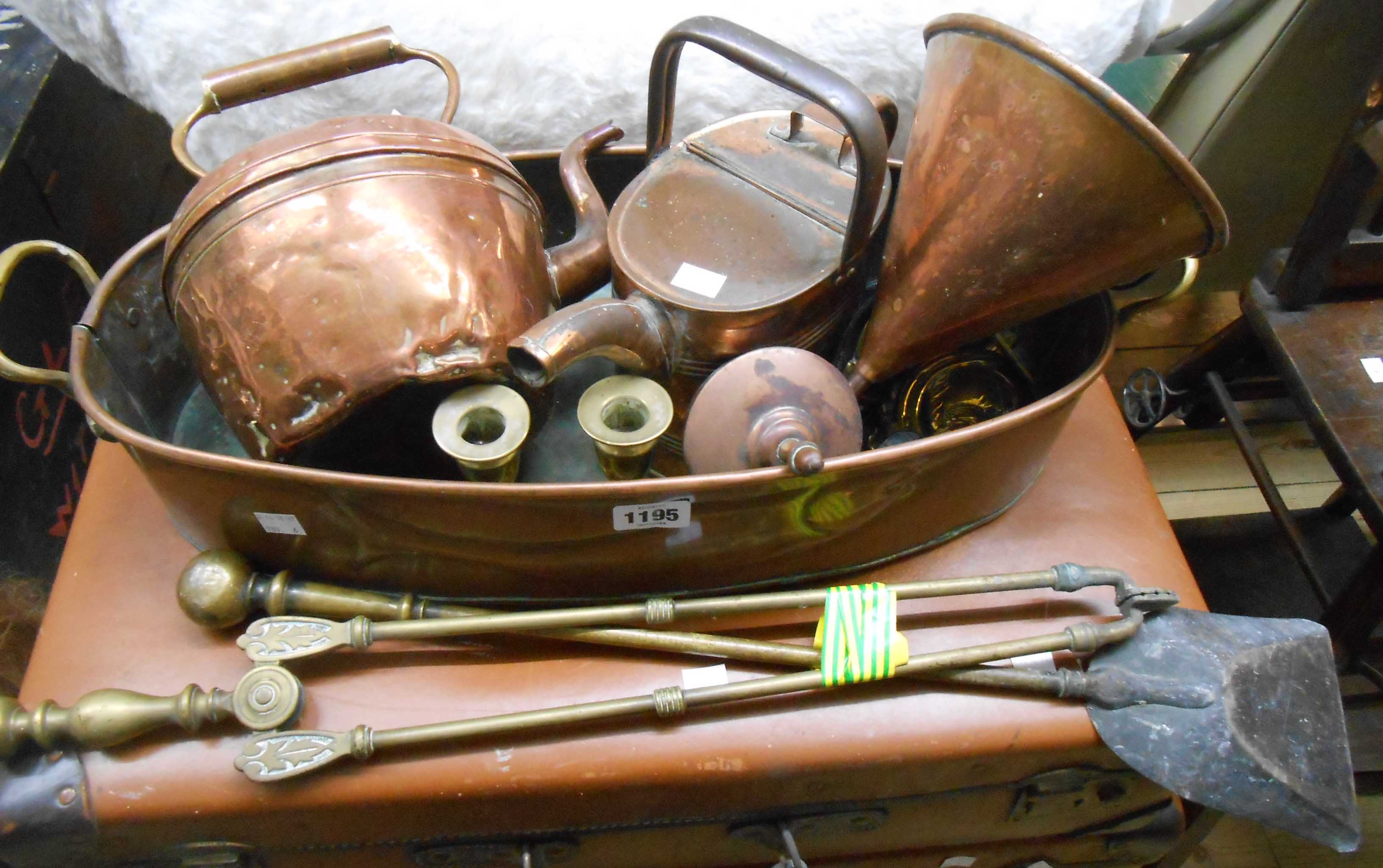 A collection of copper and brass including fish kettle, funnel, andirons, etc.