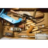 A box containing vintage tools including chisels, brace and bit, Stanley 13-030 rebate plane,