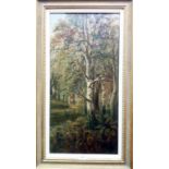 A gilt framed oil on canvas, depicting a woodland scene with figure carrying firewood on path