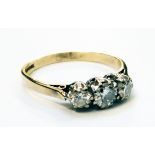 An 18ct. gold three stone diamond ring - approximately 1ct. TDW