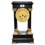 A 19th Century ebonized portico clock with decorative gilt dial and eight day bell striking