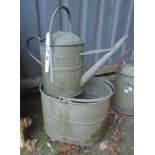 A galvanized mop bucket and watering can