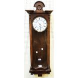 An early 20th Century walnut and glazed cased regulator wall timepiece with enamelled dial, large