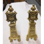 A pair of cast brass andirons with English Rose decoration