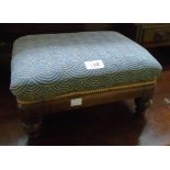 A Victorian mahogany framed foot stool with upholstered top, set on turned feet