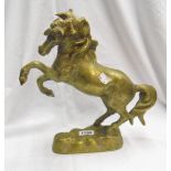 A heavy brass figure of a rearing horse