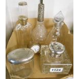 A collection of silver topped glassware including inkwell, perfume bottles, etc.