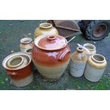 Various stoneware jars including two handled crock with lid, printed part honey glaze flagon for