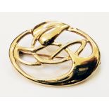 A 9ct. gold Art Nouveau style open lily pattern oval panel brooch