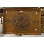 A 24" early 20th Century oak tea tray with carved Gloucester coat of arms decoration and flanking