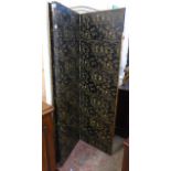 A 1920's four fold dressing screen with original oriental pattern rexine covering