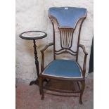 An early 20th Century inlaid mahogany framed high back elbow chair with decorative fret cut splat,