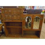 A 3' 8 1/2" eastern paduak stepped cabinet with panelled two door cupboard and twin arched