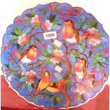 A late 20th Century Turkish shallow bowl with birds in berry bush decoration, signed front and back