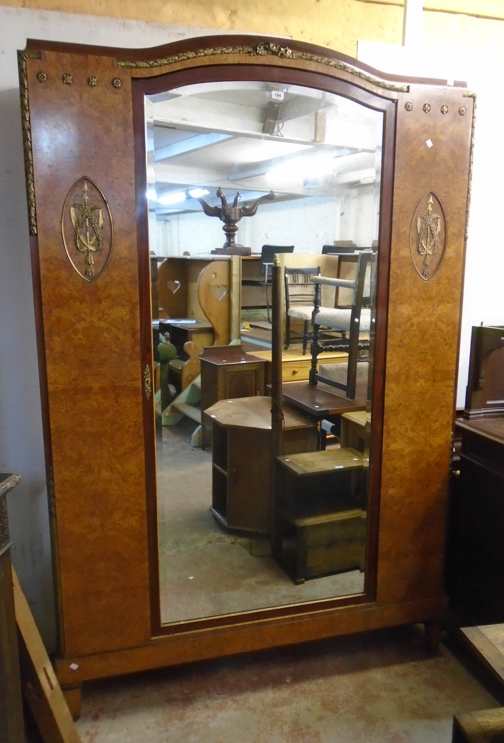 A 4' 11 1/2" French Empire style burr walnut veneered and gilt metal mounted linen cabinet with five