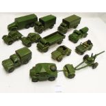 A small collection of Dinky military vehicles including Field Artillery Tractor 688, gun and limber,