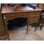 A 36" late Victorian oak writing table with later leatherette inset top, frieze drawer, kneehole and