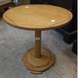 A 20" diameter 1930's polished oak pedestal table with geometric inlay and shaped base