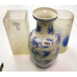 An Oriental blue and white baluster vase - sold with two glass vases
