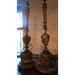 A pair of onyx and cast metal table lamps