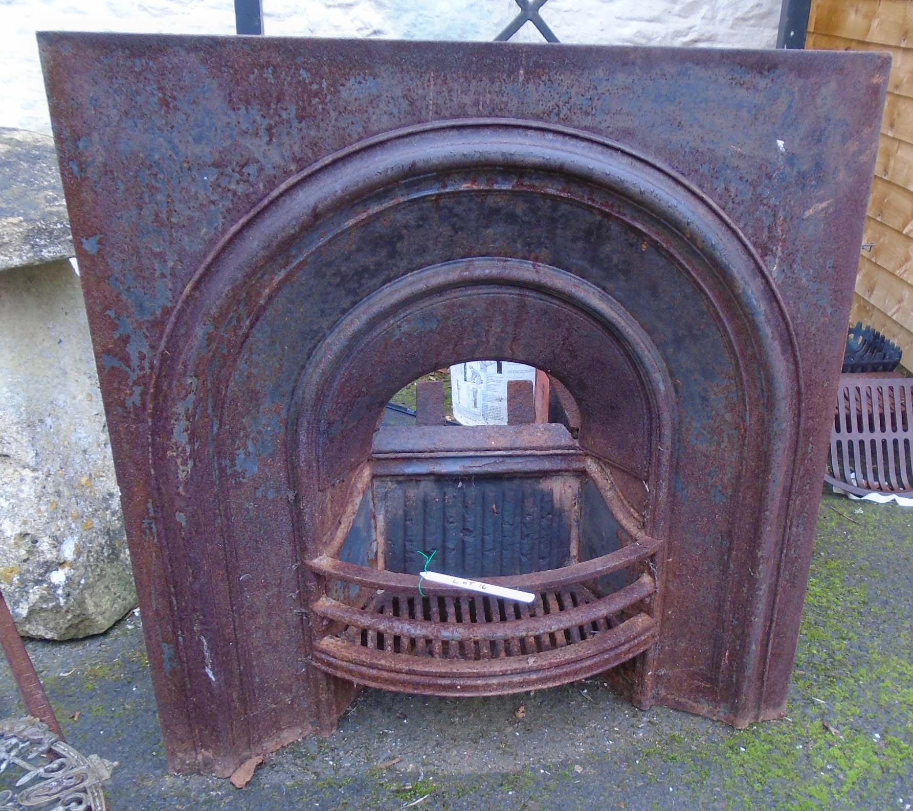 A Victorian cast iron fire place insert with dome front