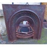 A Victorian cast iron fire place insert with dome front