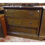 A 36" early 20th Century stained walnut chest of three long drawers, set on plinth base -