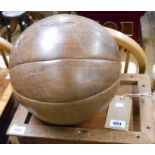 A vintage leather medicine ball