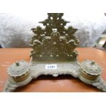 An ornate cast brass desk stand with two inkwells
