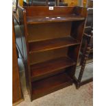 A 20 1/2" 20th Century mahogany four shelf open bookcase with later hardboard backing