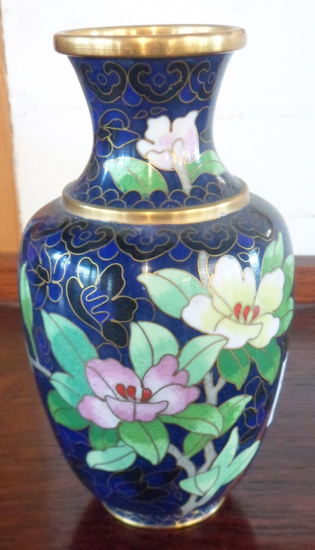 A 6 1/2" cloisonné baluster vase with floral decoration on blue ground