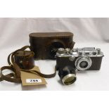 A 1934 Leica III camera No. 139234 with 50mm. f3.5 Elmar lens and original leather case