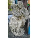 A 26" concrete garden statue in the form of a courting couple