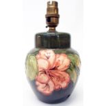 A 6" Moorcroft Hibiscus pattern table lamp in the style of a ginger jar