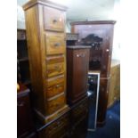 A MODERN HARDWOOD GLAZED CORNER CUPBOARD, slim chest of five drawers, CD cabinet, etc (4)