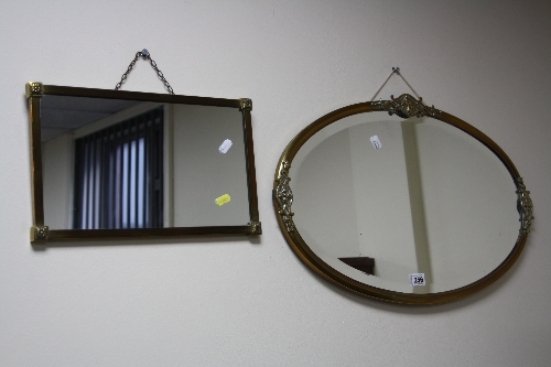 AN OVAL DECO DESIGN BRASS MIRROR, and another smaller rectangular shaped mirror (2)