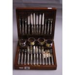 AN OAK CASED CANTEEN OF TWENTY FOUR SET, dessert knives and forks by Daniel and Arter, together with