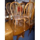 AN OAK DRAW LEAF TABLE, and four spindle back chairs (5)