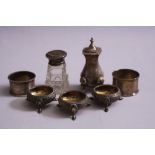 SILVER, to include a pair of open salts with rose and foliate decoration on three cabriole feet,