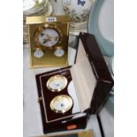 A BRASS TABLE TOP CLOCK/TEMPERATURE/HYGROMETER, together with cased 'Rapport' double clock set (2)