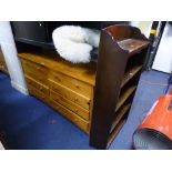 A MODERN LOW PINE CHEST, of eight long drawers and an oak open bookcase (2)