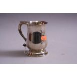 A SILVER BALUSTER MUG, having flat thumb rest, scroll handle, circular foot, Birmingham 1973