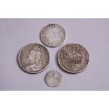 FOUR MIXED SILVER COINS (4)