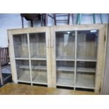 A LARGE PINE GLAZED TWO DOOR BOOKCASE, approximate size width 158cm x height 187cm x depth 36cm (