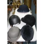 FIVE VARIOUS RIDING HATS, to include 'Champion', a boxed 'Hartmeyer Saddlery' felt hat etc